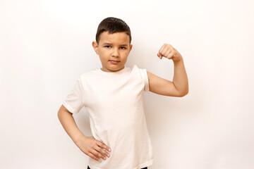 The guy strained his muscles, showing off his biceps. Healthy lifestyle and sports.