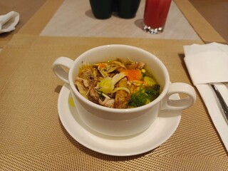 Traditional Indonesian chicken soup or soto, served for breakfast at some local hotel. Comfort food for any day.