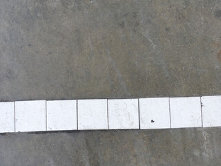 Fototapeta premium white brick floor texture with cement background