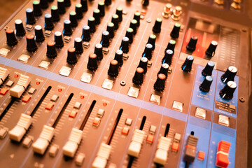 Console control panel of a large hi-fi system audio equipment Close-up of digital studio mixer...