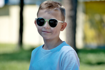 Portrait of a little boy in sunglasses.Model portrait