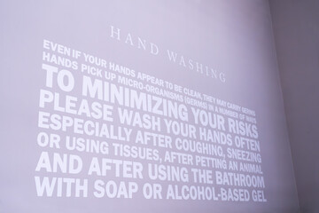 A wall with messages about washing your hands thoroughly to reduce the risk of various germs. health care concept