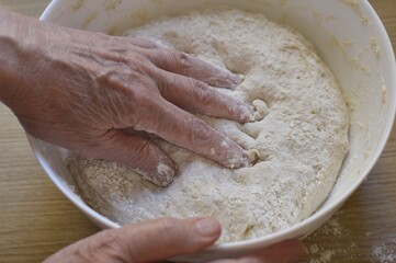 baker kneading dough