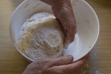 hands mixing dough