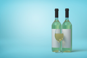 Two white wine bottles and a glass on blue backdrop