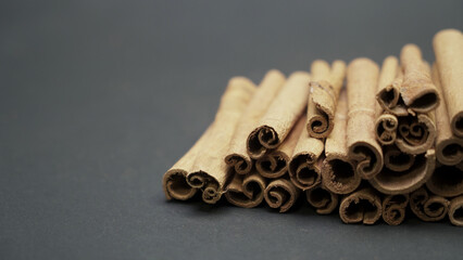 Cinnamon sticks on dark background
