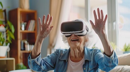photo of happy senior woman wearing a VR headset in her living room, hands raised up to touch something virtual.