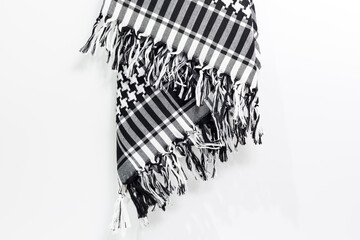 A traditional pattern head-tied garment 'Keffiyeh' or 'Puşi' on a white isolated background. Keffiyeh is widely used in the Middle East and the Arab World.