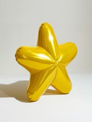 inflatable ball in the shape of a star in gold color isolated on a white background