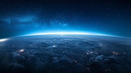 Obraz premium An expansive view of our planet Earth surrounded by a thin blue atmospheric glow and the vast cosmos, highlighting the cloud-covered surface