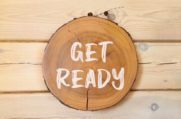 Get ready symbol. Concept words Get ready on beautiful wooden circle. Beautiful wooden wall...