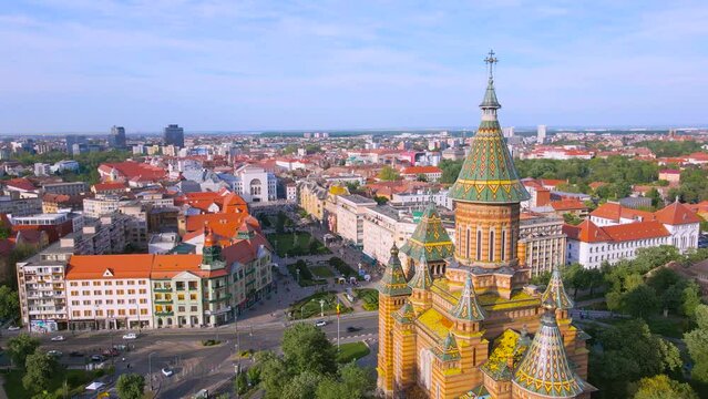 Aerial view of the beautiful city of Timisoara, Romania. Footage was shot from a drone at a higher altitude with the Mitropolitan Cathedral and The Victory Square in the view.