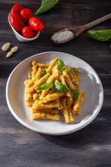 Sicilian pasta with almond and tomatoes pesto. Typical Italian food from Sicily, pasta with red pesto.