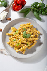 Sicilian pasta with almond and tomatoes pesto. Typical Italian food from Sicily. Food suitable for vegetarians.