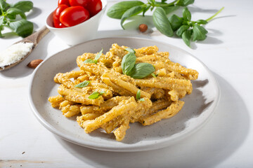 Sicilian pasta with almond and tomatoes pesto. Typical Italian food from Sicily. Food suitable for vegetarians.