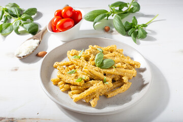 Sicilian pasta with almond and tomatoes pesto. Typical Italian food from Sicily. Food suitable for vegetarians.