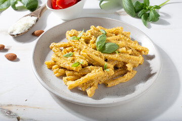 Sicilian pasta with almond and tomatoes pesto. Typical Italian food from Sicily. Food suitable for vegetarians.