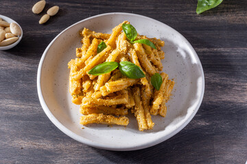 Sicilian pasta with almond and tomatoes pesto. Typical Italian food from Sicily, pasta with red pesto.