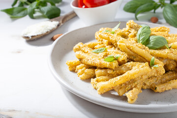 Sicilian pasta with almond and tomatoes pesto. Typical Italian food from Sicily. Food suitable for vegetarians.