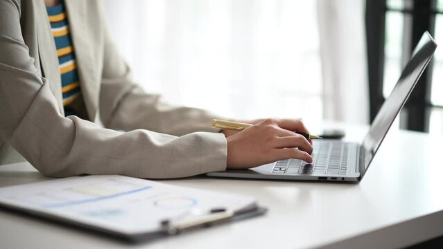 Businesswoman using on smartphone and tablet and laptop at moderm office