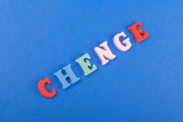 CHENGE word on blue background composed from colorful abc alphabet block wooden letters, copy space...