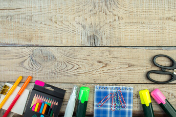 Back to school. Scissors, pencils, paper clips, notepad, markers, ruler. School supplies on a...