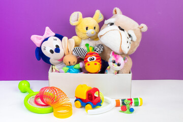 Collection of colorful toys on purple background. Kids toys.