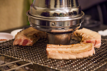 View of grilling pork in the restaurant