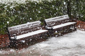 View of the bench in the snowing apartment