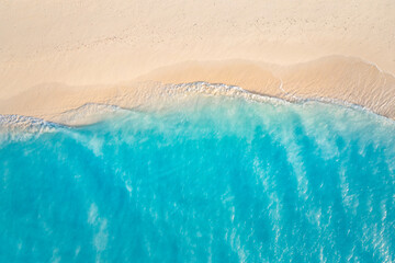 Summer seascape beautiful waves, blue sea water in sunny day. Top view from drone. Sea aerial surf,...