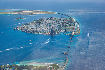 Beautiful aerial view on male the capital city of Maldives. Overcrowded island in Indian ocean blue...