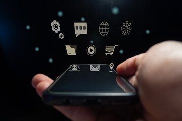 Hand holding a smart phone with virtual digital icon
