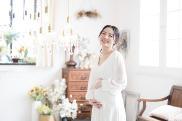 Images of maternity photos at weddings, looking at the camera, pre-shoots, and happy pregnant women.