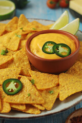Corn tortilla chips with cheese sauce