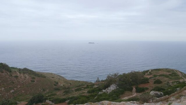 A view looking out from Dingli Cliffs on a cloudy day. Malta. 