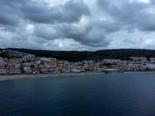 Obraz premium Aerial view of calm Atlantic Ocean with ships in the background
