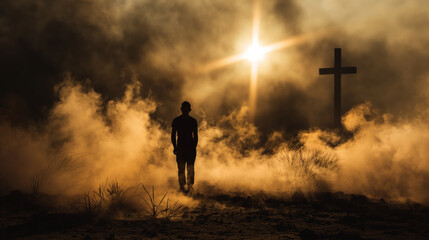 Fototapeta premium Silhouette of a man in the desert with a cross in the smoke and dust under light the sun, religion concept. 