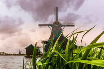 Old wooden windmills in the town of Zaanse Schans in the Netherlands