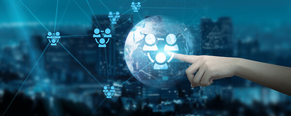 Hand touching global network connection on screens filled with data, dots, and lines, illustrating the intricate web of connectivity in our digital age. 