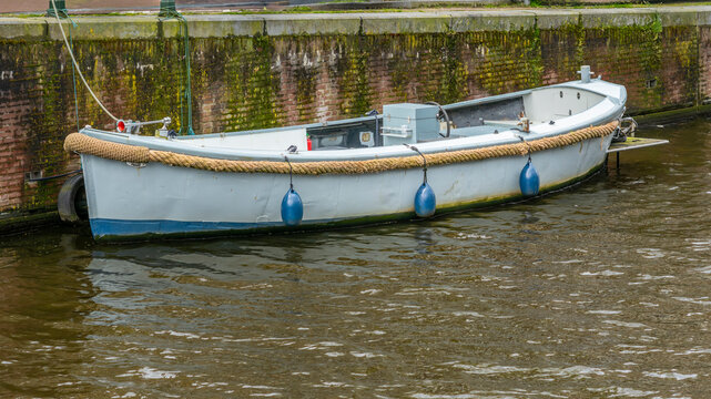 A boat on the Singel Canal in Amsterdam in spring