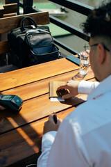Businessman in a restaurant.
A businessman paying the bill in a restaurant