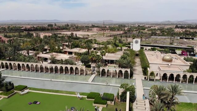 Beautiful Woman walking near the water, Palais namaskar, Luxury oasis in Marrakech, Morocco