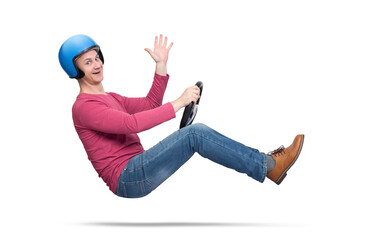 A happy young man in a motorcycle helmet drives a car and sends greetings to the camera, isolated...