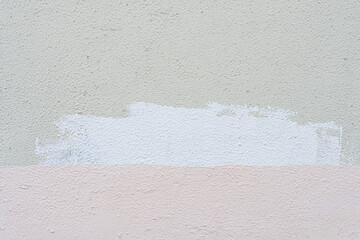 Traces of paint on old white plaster. Abstract construction background.