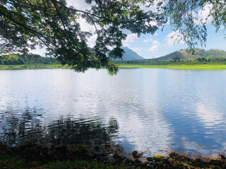 Lake serenity: stunning green mountains backdrop