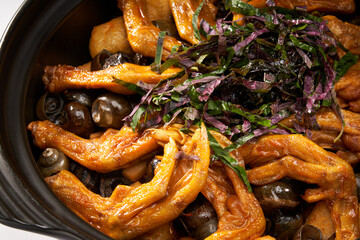 A pot of delicious and fragrant screws, snails and duck feet in a pot