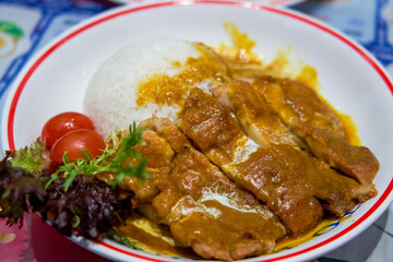A delicious curry fried chicken chop rice in a Hong Kong tea restaurant