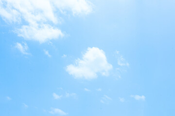 Blue Sky with Fluffy Clouds on a Bright Summer Day