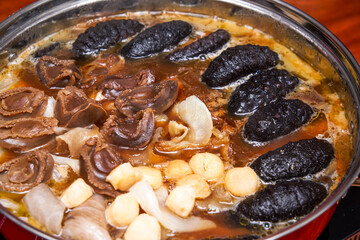 A pot of sumptuous and luxurious Chinese New Year Poon Choi, delicacies from both mountains and seas