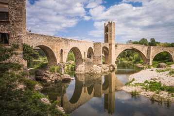 Reflections of Besalu: The Ancient Stone Bridge Amidst Nature’s Embrace